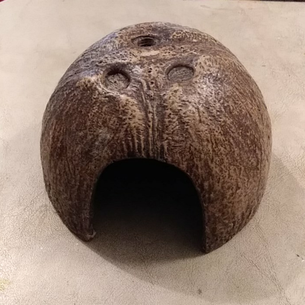 Plastic hermit crab coconut shell hut.